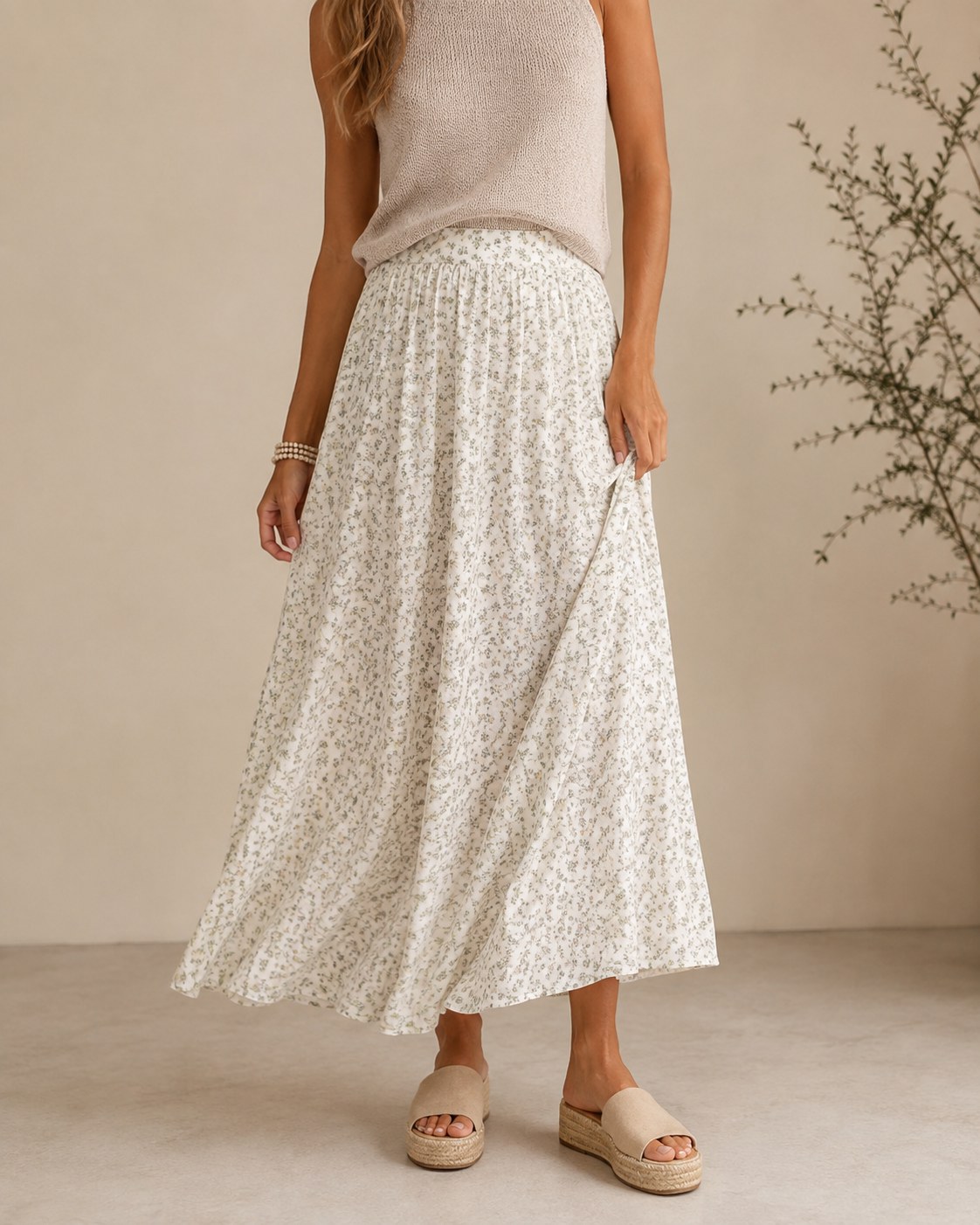 A close-up of an elastic-waist floral maxi skirt paired with platform sandals for daily comfort.